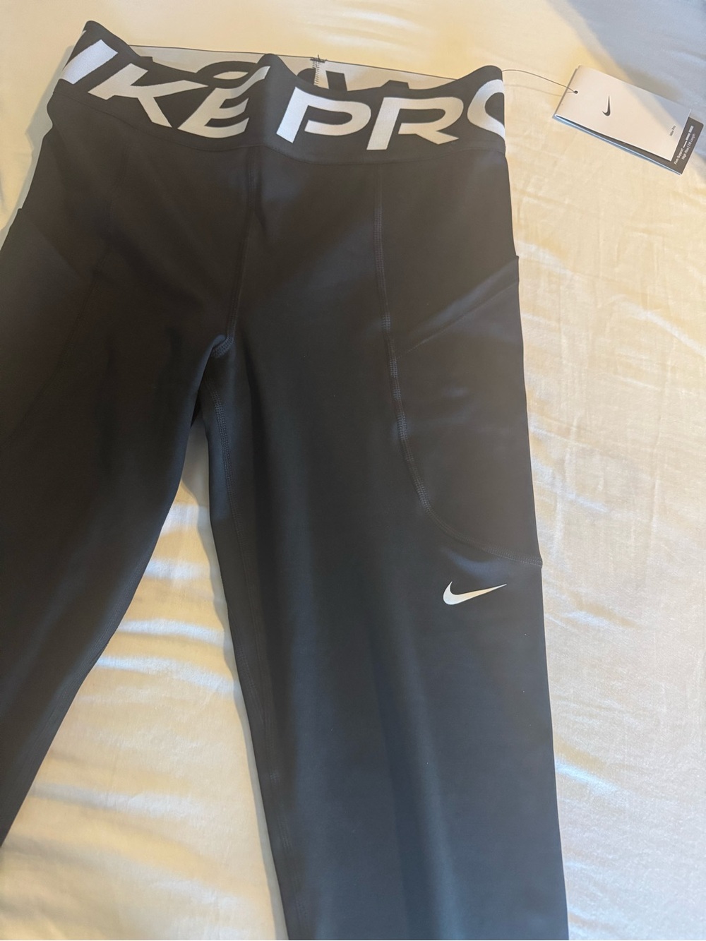 Nike Black Crop Sports Tank with White Swoosh and Branded Hem - Picture 2 of 4
